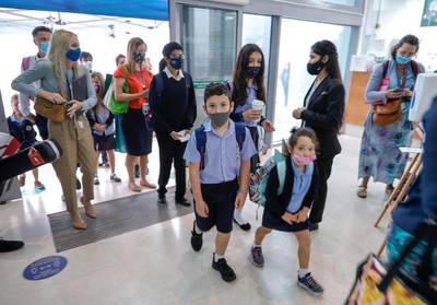 Abu Dhabi, United Arab Emirates, February 16, 2021.  Pupils return to school on Sunday at British School Al Khubairat.  --  Parents, teachers and students pass security before entering the school.Victor Besa/The NationalReporter:  Haneen DajaniSection:  NA