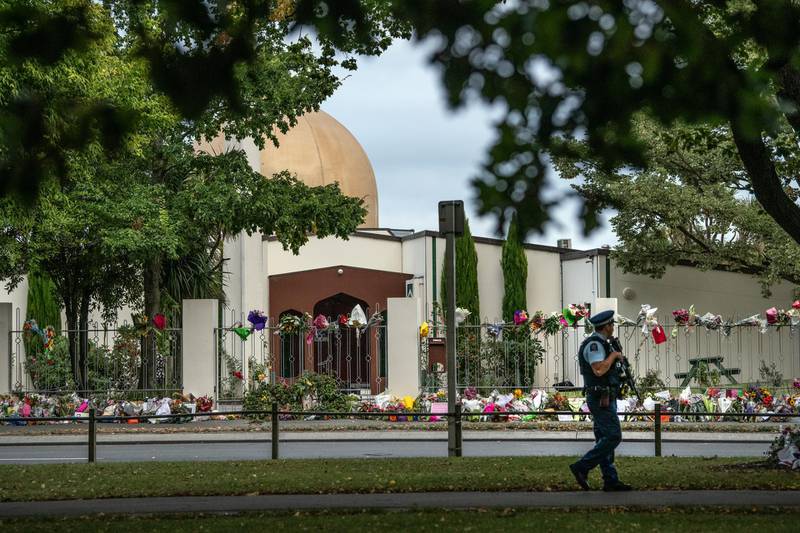 CHRISTCHURCH, NEW ZEALAND - MARCH 22: An armed police officer patrols past flowers and tributes outside Al Noor mosque on March 22, 2019 in Christchurch, New Zealand. 50 people were killed, and dozens were injured in Christchurch on Friday, March 15 when a gunman opened fire at the Al Noor and Linwood mosques. The attack is the worst mass shooting in New Zealand's history. (Photo by Carl Court/Getty Images)
