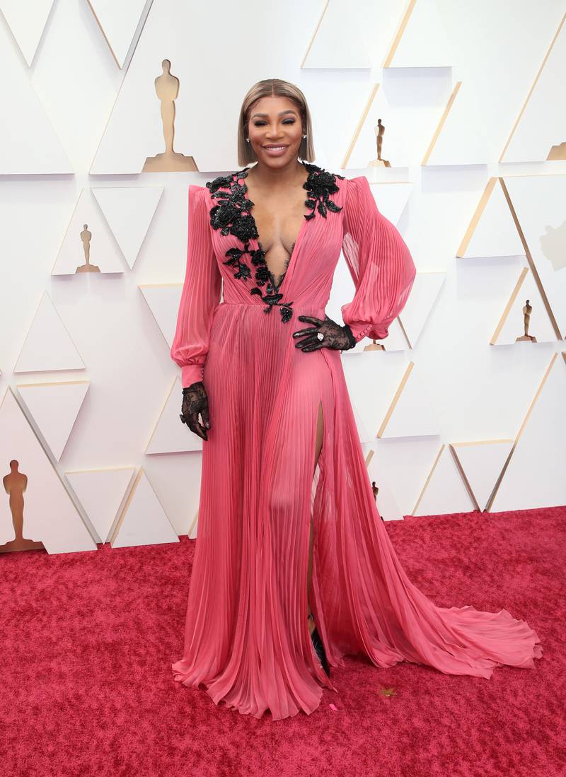 Serena Williams, wearing dusty rose Gucci, with black floral detail and gloves. AFP