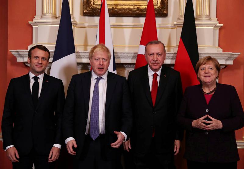 France's President Emmanuel Macron, Britain's Prime Minister Boris Johnson, Turkish President Tayyip Erdogan and German Chancellor Angela Merkel pose as they meet at Downing Street ahead of the NATO summit in London, Britain, December 3, 2019. Murat Cetinmuhurdar/Presidential Press Office/Handout via REUTERS THIS IMAGE HAS BEEN SUPPLIED BY A THIRD PARTY.