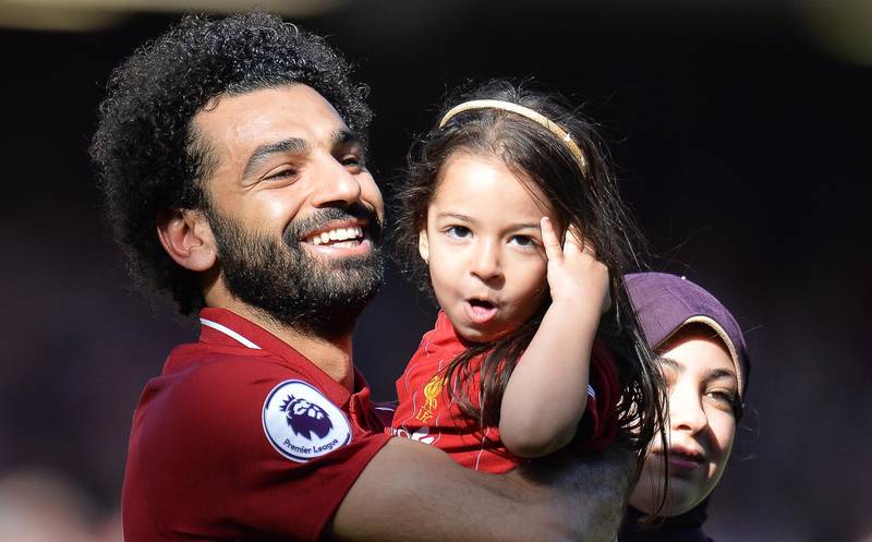 Mohamed Salah celebrates with his daughter Makka and his wife Magi.  EPA