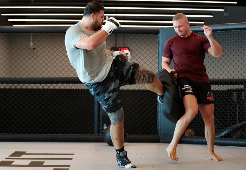 Tai Tuivasa kicks the pads during training in Dubai as he prepares for his UFC heavyweight fight in Paris, France.