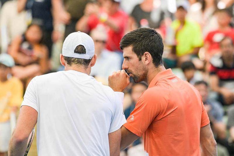 Novak Djokovic and Vasek Pospisil talk tactics. AFP