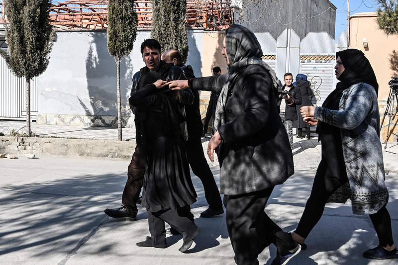 Relatives of the victims arrive at the site following gunmen shot dead two Afghan women judges working for the Supreme Court, in Kabul. AFP