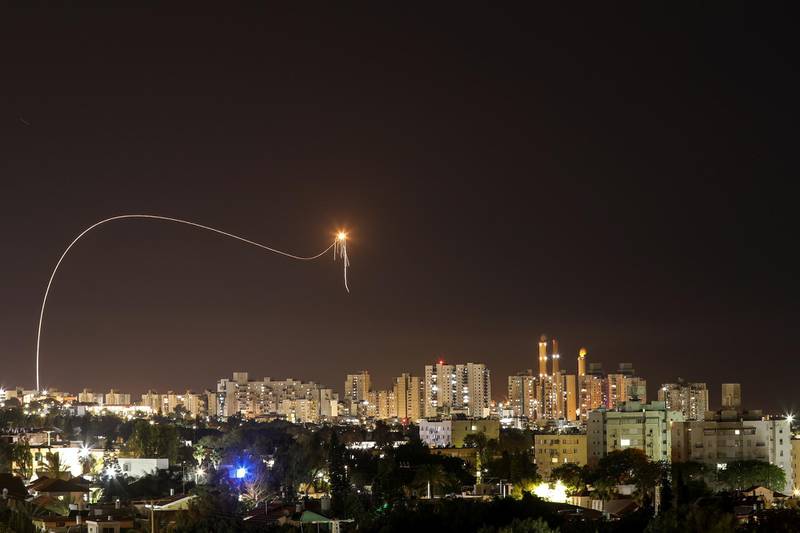 Seen from Ashkelon in Israel, a missile from Israel's Iron Dome air defence system leaves a bright trail as it moves to intercept rockets launched from the Gaza Strip. Reuters