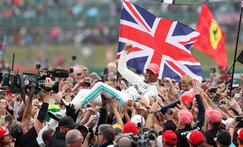 File photo dated 14-07-2019 of Mercedes driver Lewis Hamilton celebrates winning the British Grand Prix at Silverstone, Towcester. PA Photo. Issue date: Monday April 27, 2020. This year’s British Grand Prix will take place without fans after Silverstone’s owners said that a race “under normal conditions is just not going to be possible” because of coronavirus. See PA story SPORT Coronavirus. Photo credit should read David Davies/PA Wire.