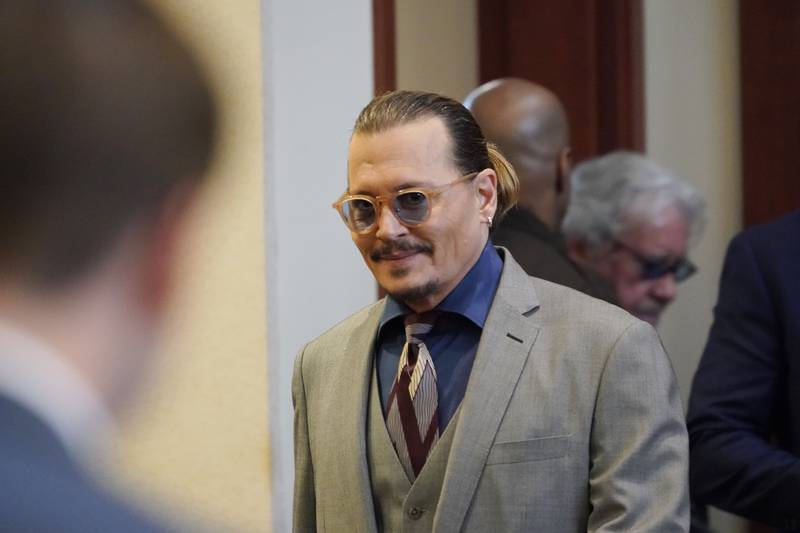 Depp arrives for day three of his ex-wife's evidence. AP