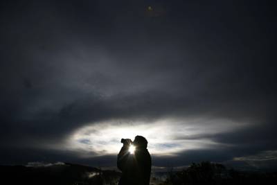 KATOOMBA, AUSTRALIA: NOVEMBER 28, 2008: UFO spotter Rex Gilroy scans the sky through his binoculars while visiting a favourite UFO spotting area November 28, 2008 in Katoomba, Australia.  Photographer: Ian Waldie. 