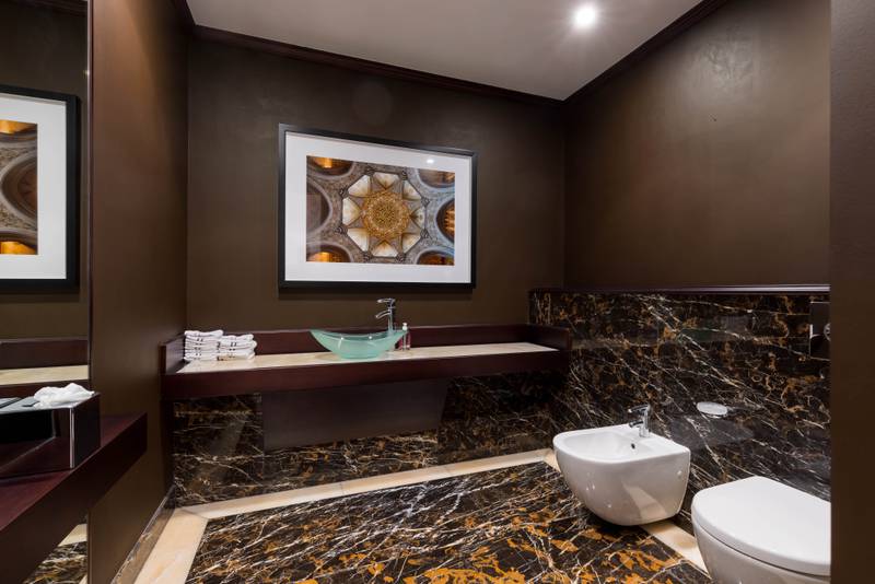 The bathrooms feature a louder design than the living areas.