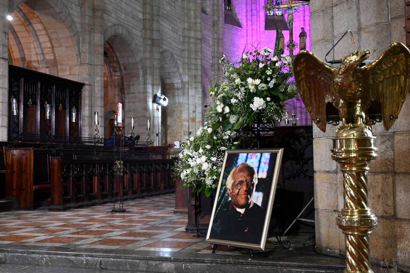 A portrait of of South African anti-apartheid campaigner Archbishop Desmond Tutu is displayed at St George’s Cathedral in Cape Town before a requiem Mass.  Tutu died on December 26, 2021 at the age of 90, prompting tributes to a life spent fighting injustice. AFP
