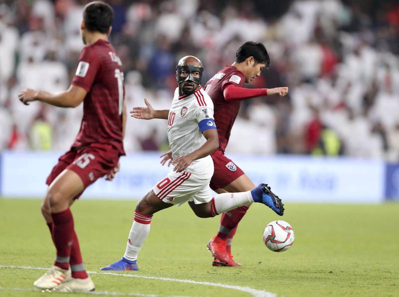 Al Ain, United Arab Emirates - January 14, 2019: Ismaeil Matar of UAE wears a protective face mask while in action during the game between UAE and Thailand in the Asian Cup 2019. Monday, January 14th, 2019 at Hazza Bin Zayed Stadium, Al Ain. Chris Whiteoak/The National