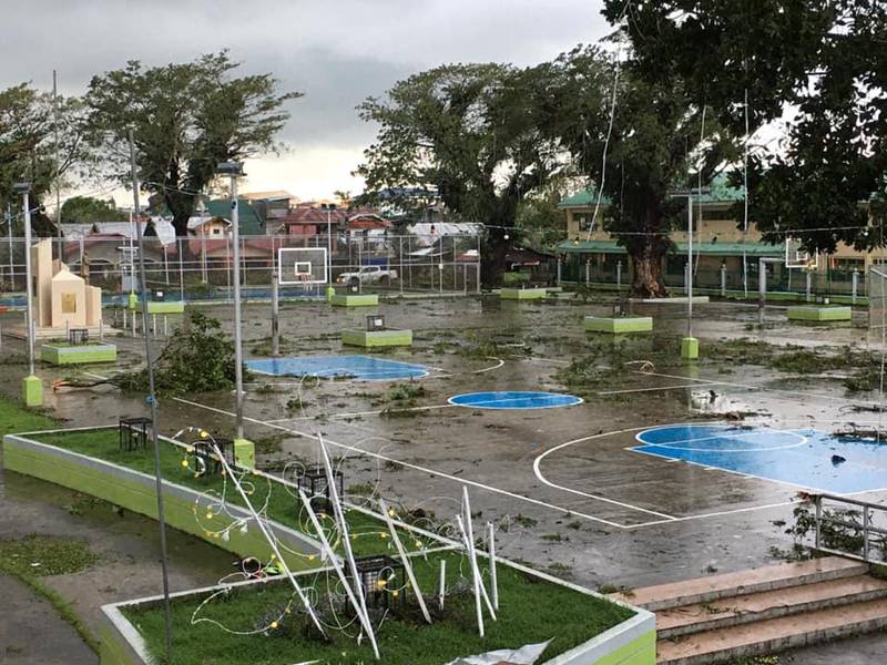 Fallen tree branches litter a basketball court after Typhoon Phanfone swept through Tanauan, Leyte, in the Philippines. Reuters