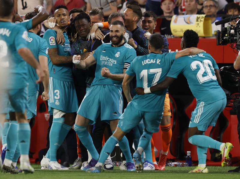 Real Madrid's Karim Benzema celebrates scoring their third goal against Sevilla. Real had trailed 2-0 at half time. Reuters