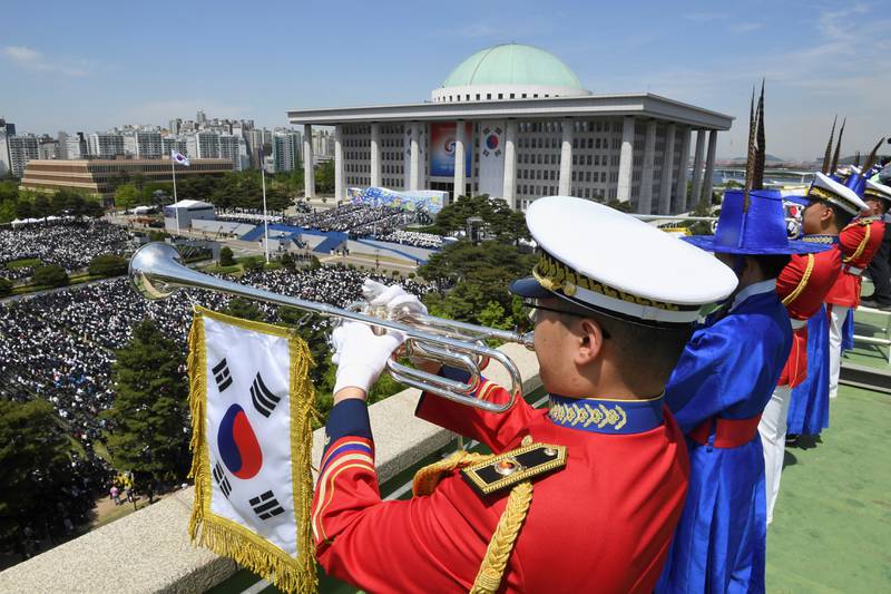 Troops present a guard of honour. Reuters