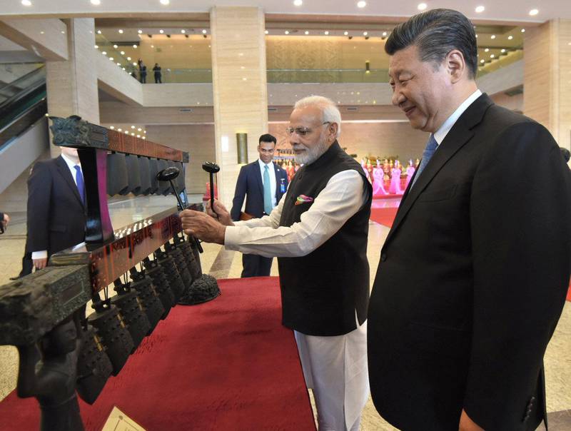 Chinese President Xi Jinping (R) and Indian Prime Minister Narendra Modi visit an exhibition at Hubei Provincial museum in Wuhan, China, April 27, 2018. India's Press Information Bureau/Handout via REUTERS ATTENTION EDITORS - THIS PICTURE WAS PROVIDED BY A THIRD PARTY. NO RESALES. NO ARCHIVE.