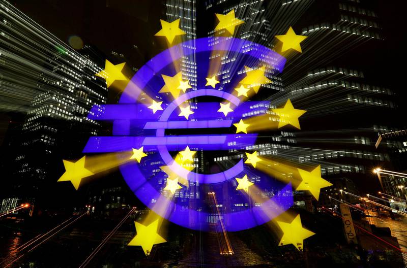 FILE PHOTO: The euro sign in front of the former headquarters of the European Central Bank (ECB) is photographed with long exposure in Frankfurt, Germany, November 20, 2017. REUTERS/Kai Pfaffenbach/File Photo