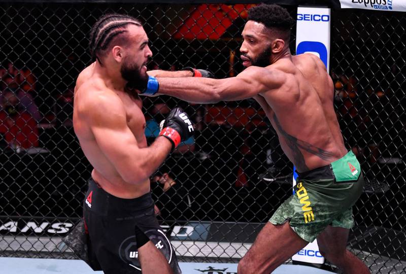 LAS VEGAS, NEVADA - FEBRUARY 13: (R-L) Phil Rowe punches Gabe Green in their welterweight fight during the UFC 258 event at UFC APEX on February 13, 2021 in Las Vegas, Nevada. (Photo by Jeff Bottari/Zuffa LLC) *** Local Caption *** LAS VEGAS, NEVADA - FEBRUARY 13: (R-L) Phil Rowe punches Gabe Green in their welterweight fight during the UFC 258 event at UFC APEX on February 13, 2021 in Las Vegas, Nevada. (Photo by Jeff Bottari/Zuffa LLC)