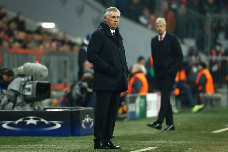 Carlo Ancelotti, left, was full of support for Arsene Wenger, right, after Bayern Munich thrashed Arsenal on Wednesday night. Odd Andersen / AFP