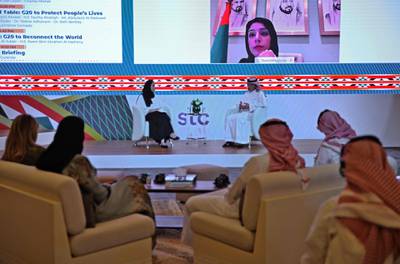 Saudi Foreign Minister Adel al-Jubeir (C-L) addresses G20 panel labelled “G20 to reconnect the world” with UAE's Minister of State for International Cooperation Reem al-Hashimy attending virtually , at the International Media Centre in Riyadh.  AFP