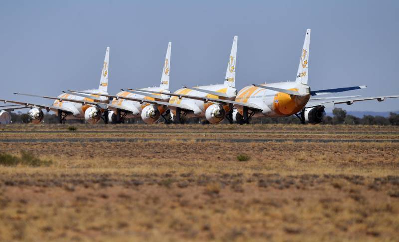 epa08654874 (FILE) - Boeing 787-8 Dreamliner airplanes of Singapore low-cost carrier Scoot Tigerair, grounded due to the Coronavirus (COVID-19) pandemic, are parked at the Asia Pacific Aircraft Storage facility in Alice Springs, Australia, 30 August 2020 (reissued 08 September 2020). US airplane manufacturer Boeing on 08 September 2020 announced that problems with the horizontal stabililzer are another issue slowing down the deliveries of the Dreamliner.  EPA/DARREN ENGLAND AUSTRALIA AND NEW ZEALAND OUT *** Local Caption *** 56307049