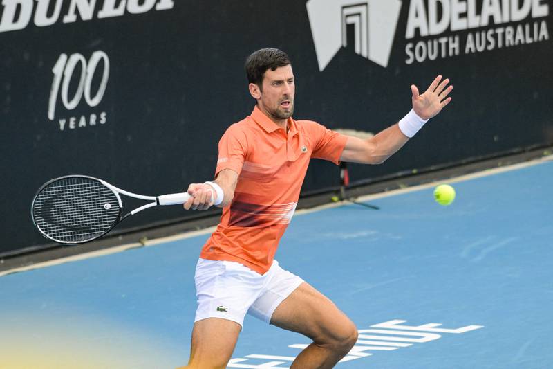Novak Djokovic hits a return. AFP