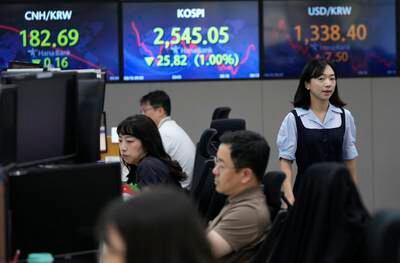 Traders watch market movements at a dealing room in South Korea. Asian shares last week amid worries over discouraging data on China, as well as over the future of the US  economy. AP