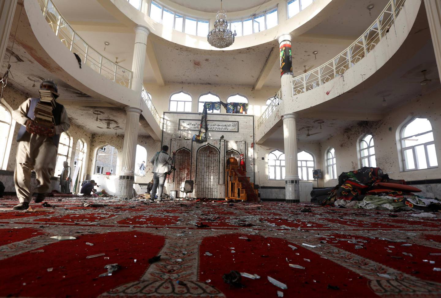 ATTENTION EDITORS - VISUAL COVERAGE OF SCENES OF DEATH AND INJURY Afghan men inspect inside a Shi'ite Muslim mosque after last night's attack in Kabul, Afghanistan October 21, 2017.  REUTERS/Omar Sobhani