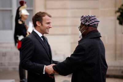 French President Emmanuel Macron welcomes Mr Obasanjo  upon his arrival at the Elysee Palace in Paris, France. EPA