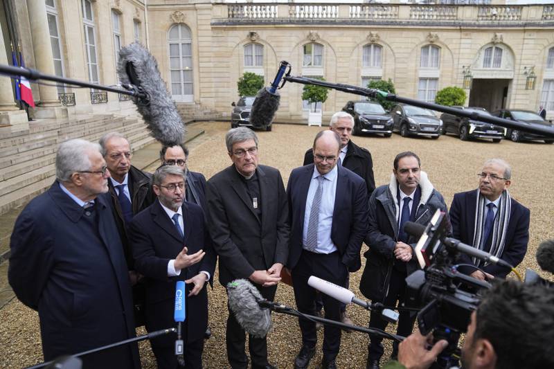 Religious representatives address the media after a meeting with France's President Emmanuel Macron at the Elysee Palace. AP