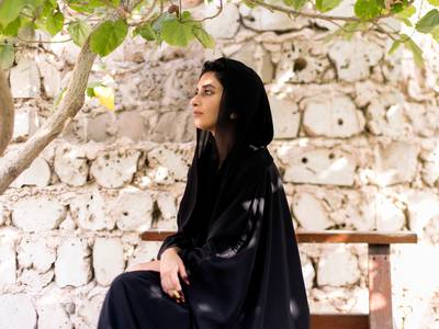 SHARJAH, UNITED ARAB EMIRATES, 28 JUNE 2017. Jewelry and abaya designer Alia Bin Omair at Sharjah Art Foundation's Communal Garden.Photo: Reem Mohammed / The National (Reporter: Roberta Pennington / Section: WK) ID 87865 *** Local Caption ***  RM_20170628_WK_ABAYA_010.JPG