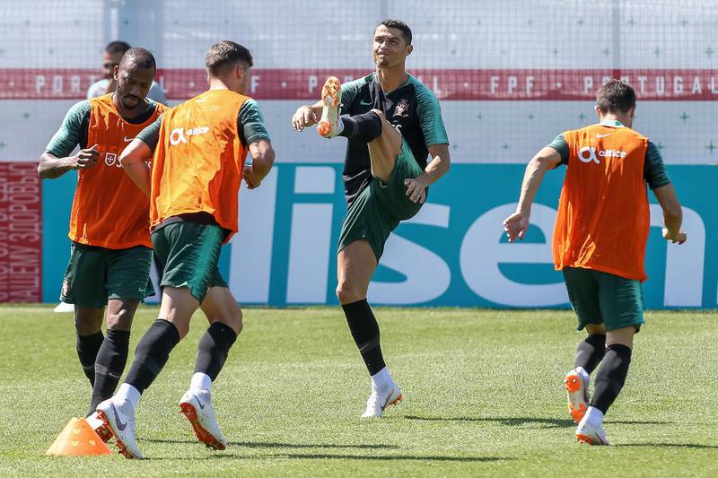Cristiano Ronaldo (2-R) warms up during a training session at the Kratovo training camp in Ramensky, Moscow region, on Friday.  Paulo Novais / EPA