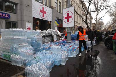 Aid workers carry bottled drinking water to a humanitarian centre in Odesa. From there it will be sent to the neighbouring city of Mykolaiv, which has been without its central water supply for days as a result of damage during hostilities with Russian troops. AFP