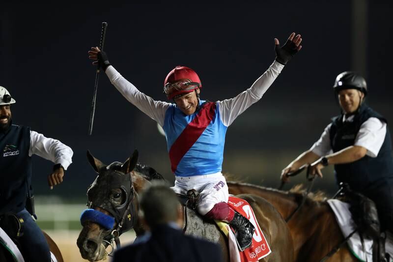Frankie Dettori celebrates after winning the Dubai World Cup on Country Grammer. Chris Whiteoak / The National
