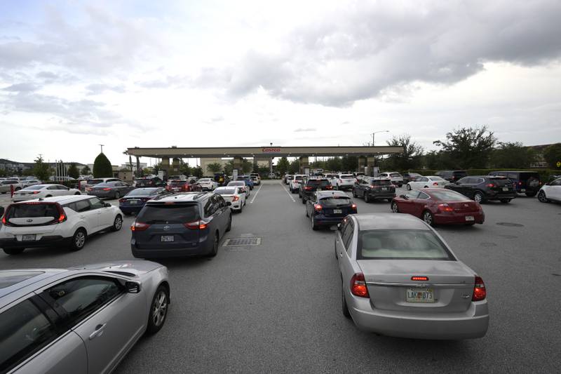 Queues to fill up cars at a Costco Wholesale shop in Orlando as Hurricane Ian approaches. AP Photo