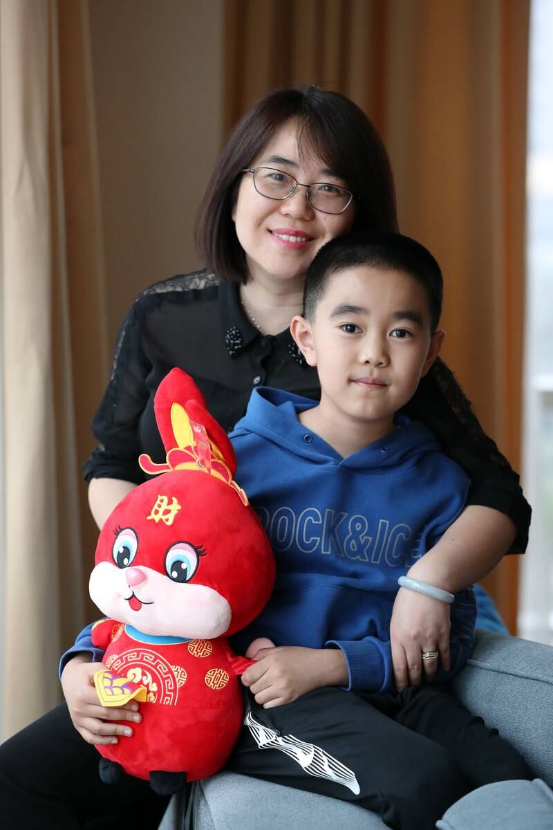Chinese mum Wu Zixuan and her son Ming who have moved to Dubai so the family can be together. Chris Whiteoak / The National