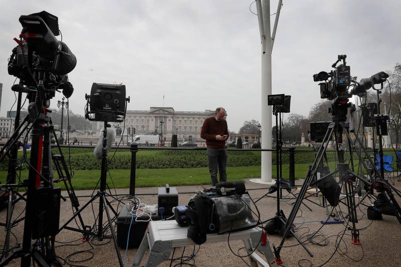 Television equipment is set up in front of Buckingham Palace in London, Monday, March 8, 2021. Britain's royal family is absorbing the tremors from a sensational television interview by Prince Harry and the Duchess of Sussex, in which the couple said they encountered racist attitudes and a lack of support that drove Meghan to thoughts of suicide. (AP Photo/Kirsty Wigglesworth)