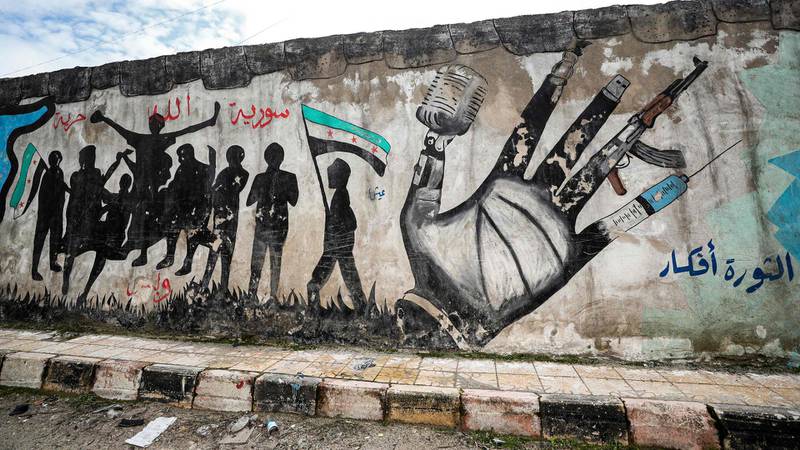 A mural inspired by the 2011 Syrian uprising in the deserted city of Kafranbel, south of Idlib city. AFP