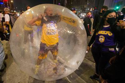 Los Angeles Lakers fans celebrate their team winning the 2020 NBA Championship against the Miami Heat, during the outbreak of Coronavirus disease in Los Angeles, California, U.S. REUTERS