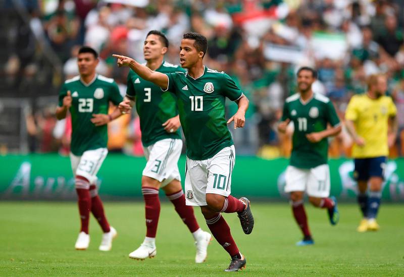 18 Mexico ||
The look: The first of Adidas' bespoke kits to rank high, Mexico's green shirts, white shorts and red socks flirts safely between it's traditional look and modern detailing. ||
Would I wear it? Yes ||
Photo: Alfredo Estrella / AFP Photo