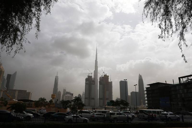 Significantly hotter summers with increased sandstorms, higher humidity and more rain that could trigger flash-flooding are among the possible effects of climate change on the UAE, a new report says. Pawan Singh / The National