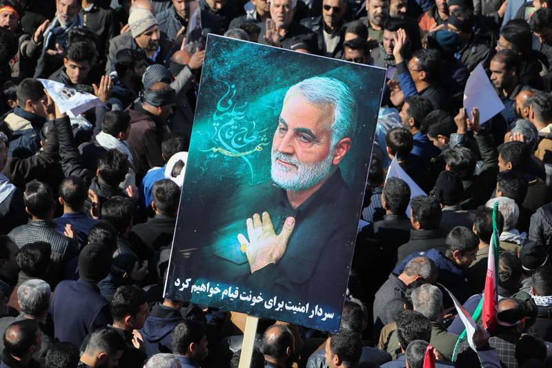 Iranian mourners gather during the final stage of funeral processions for slain top general Qasem Soleimani, in his hometown Kerman on January 7, 2020.  Soleimani was killed outside Baghdad airport on January 3 in a drone strike ordered by US President Donald Trump, ratcheting up tensions with arch-enemy Iran which has vowed "severe revenge". The assassination of the 62-year-old heightened international concern about a new war in the volatile, oil-rich Middle East and rattled financial markets. / AFP / ATTA KENARE
