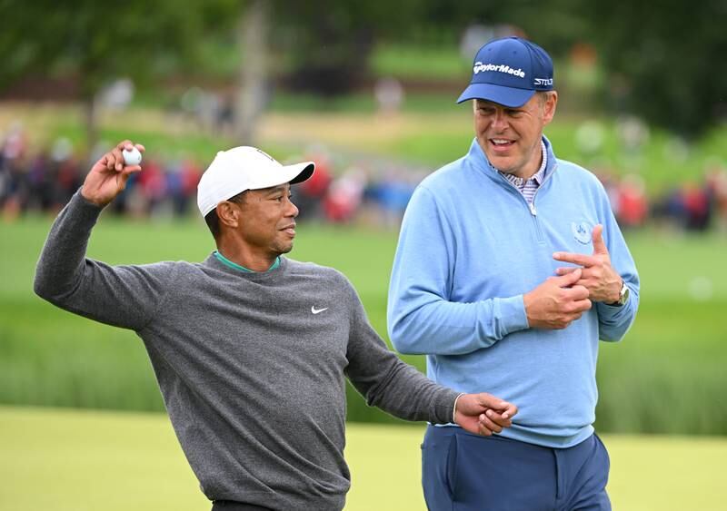 British entrepreneur Peter Jones with playing partner Tiger Woods of United States as they finish their round during Day Two of the JP McManus Pro-Am at Adare Manor. Getty Images