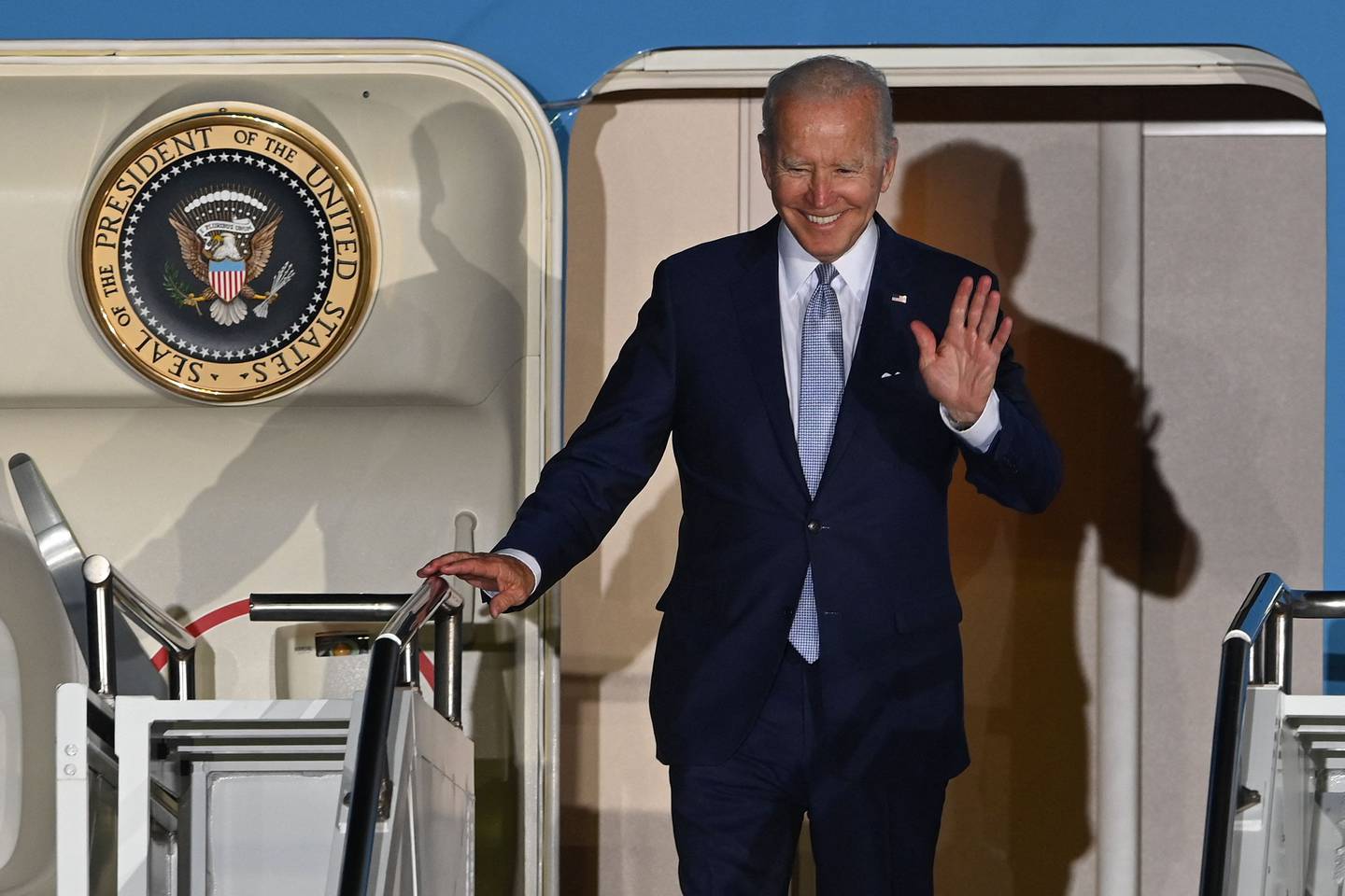 US President Joe Biden waves as he disembarks from Air Force One upon his arrival in Munich on the eve of the G7 summit. AFP