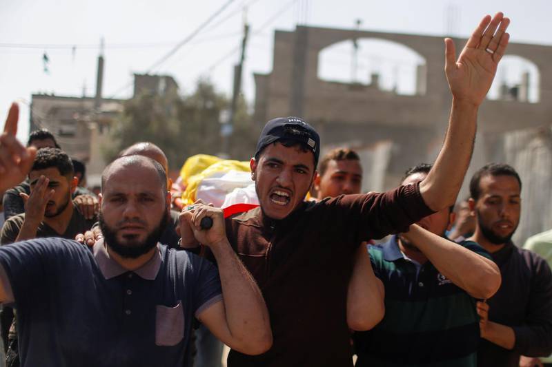 Mourners carry the body of Palestinian boy Hussien Hamad during his funeral in the northern Gaza Strip. Reuters