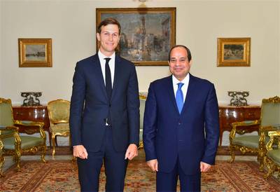 In this photo provided by Egypt's state news agency, MENA, Egypt's President Abdel-Fattah el-Sissi, right, poses for a photo with White House adviser Jared Kushner, in Cairo, Egypt, Wednesday, Aug. 23, 2017. El-Sissi and Egypt's foreign minister have met with Kushner just hours after the Trump administration cut or delayed hundreds of millions of dollars in aid to Cairo over human rights concerns. Kushner, who is also President Donald Trump's son-in-law, was in Cairo as part of a Middle East tour aimed at exploring ways to revive Israeli-Palestinian peace talks, which last collapsed in 2014. (MENA via AP)
