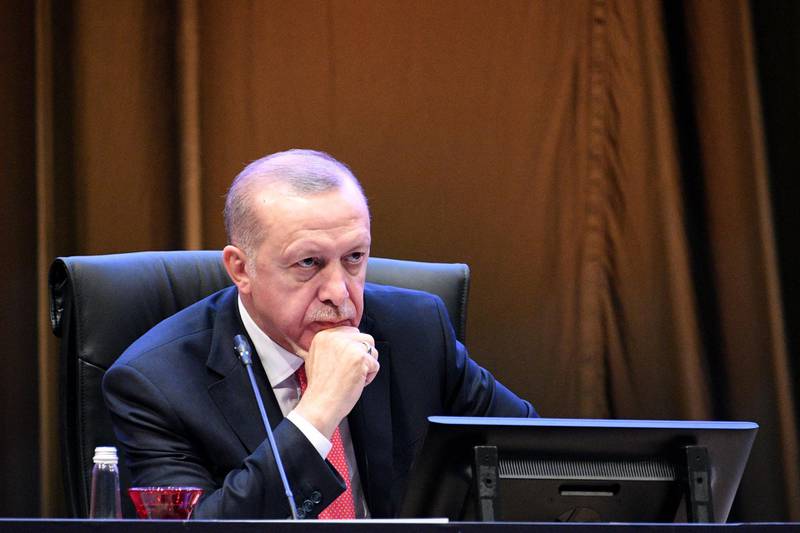 This handout from Malaysia's Department of Information taken and released on December 19, 2019 shows Turkey's President Recep Tayyip Erdogan attending the first round table session of the Kuala Lumpur Summit 2019 in Kuala Lumpur. -----EDITORS NOTE --- RESTRICTED TO EDITORIAL USE - MANDATORY CREDIT "AFP PHOTO / MALAYSIA'S DEPARTMENT OF INFORMATION / FANDY AZLAN " - NO MARKETING - NO ADVERTISING CAMPAIGNS - DISTRIBUTED AS A SERVICE TO CLIENTS 
 / AFP / DEPARTMENT OF INFORMATION / Fandy Azlan / -----EDITORS NOTE --- RESTRICTED TO EDITORIAL USE - MANDATORY CREDIT "AFP PHOTO / MALAYSIA'S DEPARTMENT OF INFORMATION / FANDY AZLAN " - NO MARKETING - NO ADVERTISING CAMPAIGNS - DISTRIBUTED AS A SERVICE TO CLIENTS 
