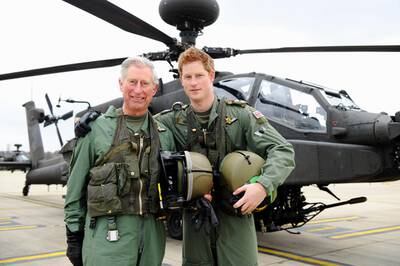 Prince Charles and Harry in front of an Apache helicopter at the Army Aviation Centre in Middle Wallop, 2011 