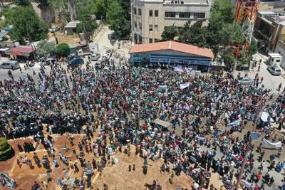 A photo taken with a drone shows an aerial view of a protest against the presidential elections, in Idlib, Syria, 26 May 2021. EPA