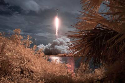 A SpaceX Falcon 9 rocket carrying the company's Crew Dragon spacecraft is seen in this false colour infrared exposure as it is launched on Nasa's SpaceX Demo-2 mission to the International Space Station with Nasa astronauts Robert Behnken and Douglas Hurley onboard, at Nasa's Kennedy Space Centre in Cape Canaveral, Florida, US.  EPA