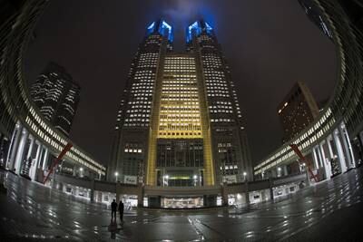The Tokyo Metropolitan Government building is lit with the Ukraine national flag colours. Getty Images
